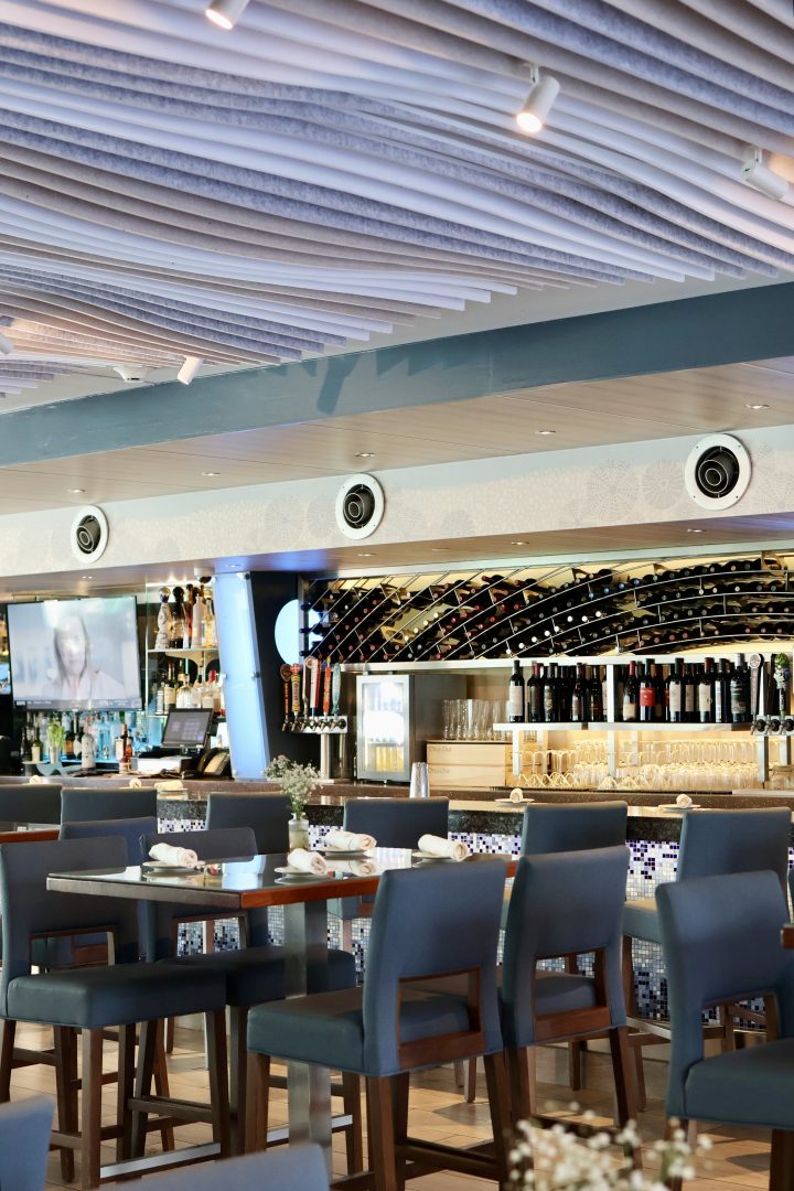 Shade Hotel Manhattan Beach interior of Zinc at Shade coastal Californian restaurant. Empty bar and high tabletop seating is shown.